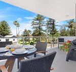 Bathers at the Beach across from Surf Beach - QLD Tourism